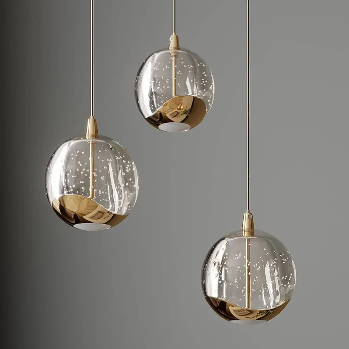 Lucande LED Pendelleuchte in transparent, gold, Hängelampe -  - Drei Pendelleuchten mit klaren Glaskugeln, internen Blasen und goldenen Akzenten.