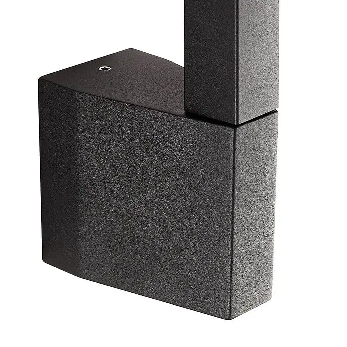 Lindby LED Wandleuchte aussen in schwarz, weiß, Aussenlampe Wand -  - Nahaufnahme eines schwarzen, strukturierten rechteckigen Metallteils, möglicherweise eine Basis oder ein Verbinder.