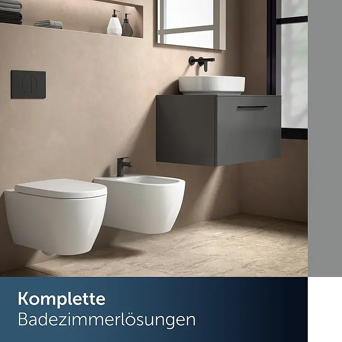 Ideal Standard Bidetarmatur Alero Schwarz Matt -  - Moderner Badraum mit wandhängendem WC, Bidet und Waschtisch. Schwarze Armaturen und beige Wände zeigen komplette Badlösungen.