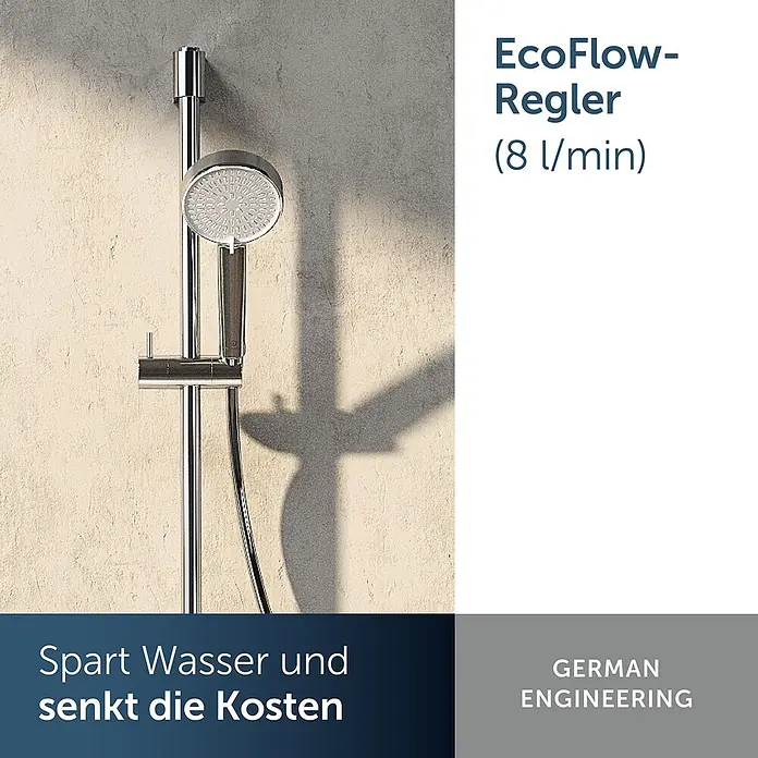 Ideal Standard Brause-Set - Chrom - Eine moderne Handbrause aus Chrom mit rundem Duschkopf, montiert an einer passenden Brausestange an einer strukturierten Wand.