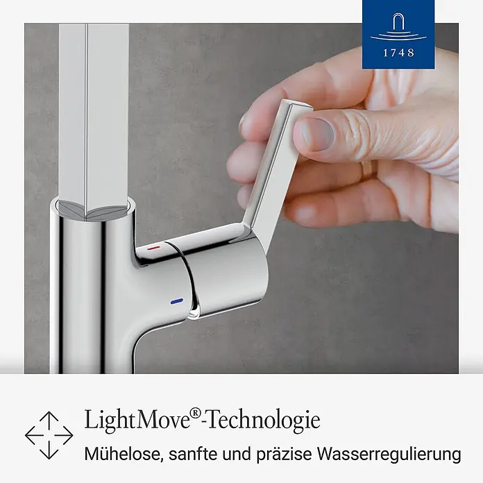 Villeroy & Boch Spültischarmatur - Chrom, Hochglänzend - Hand betätigt modernen Chrom-Wasserhahn mit roten und blauen Temperaturanzeigen, demonstriert präzise Steuerung.
