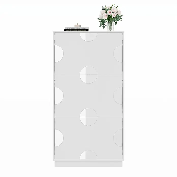 SONNENH Schuhschrank - Weiß - Weißer Schrank mit geometrischem Kreismuster, darauf Bücher und eine Vase mit rosa Blumen.