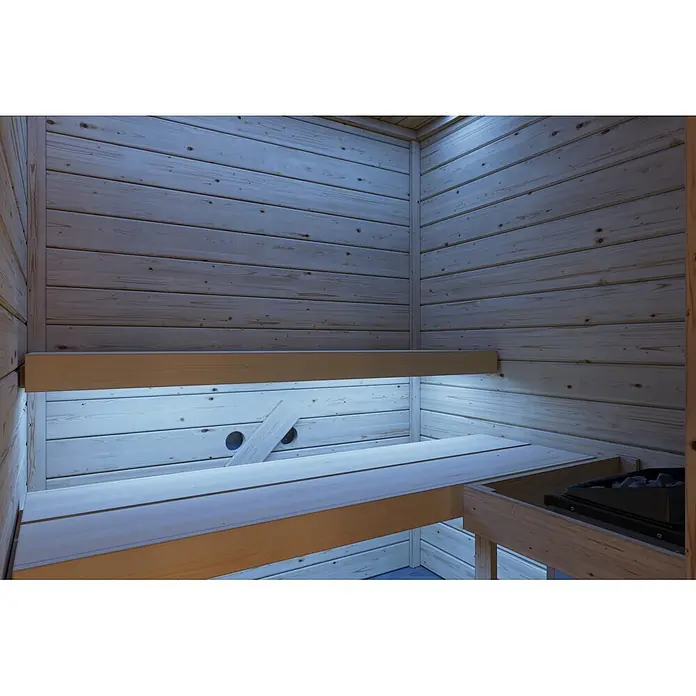 Karibu Elementsauna Oda - Mit Ofen, L x B x H: 145 x 148 x 190,5 cm - Gemütliches Saunainnere aus hellem Kiefernholz mit Bänken und Heizgerät, sanft beleuchtet von blauen LED-Lichtern.