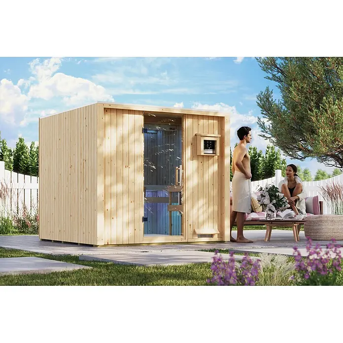 Karibu Saunahaus Tim - 9 KW Bio-Ofen mit externer Steuerung, Natur, L x B x H: 224 x 219,5 x 196 cm - Helle Holz-Außensauna mit Glastür in einem Garten, Personen genießen die Freizeit.