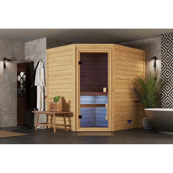 Karibu Elementsauna Corner - Mit Ofen, L x B x H: 170 x 196 x 202 cm - Saunakabine aus hellem Holz mit Glastür in einem modernen Badezimmer.