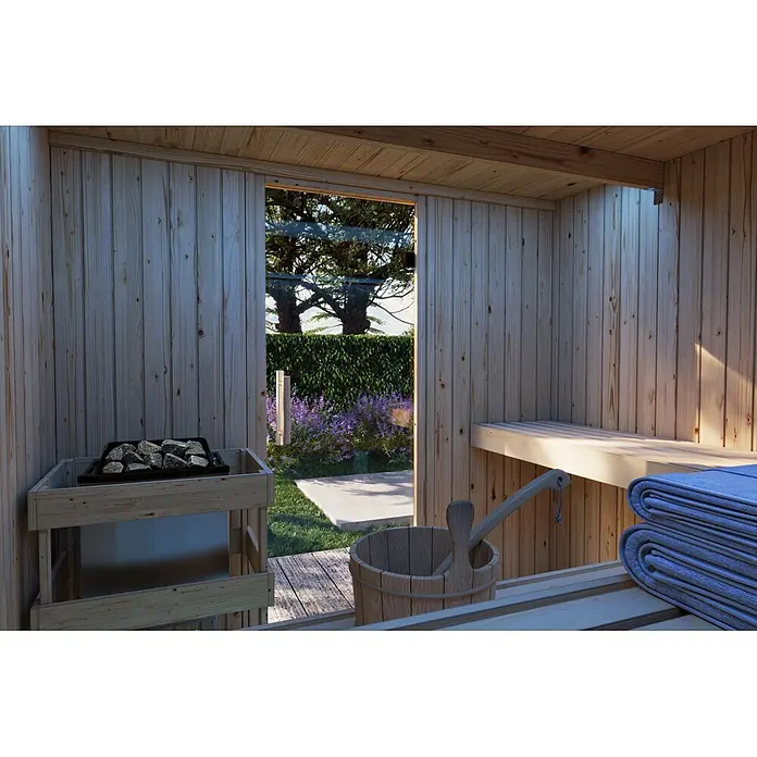 Karibu Saunahaus Tim - Ohne Ofen, Schwarz, L x B x H: 224 x 219,5 x 196 cm - Gemütliches Holzsauna-Interieur mit steinbefülltem Ofen, Holzeimer, blauen Handtüchern auf der Bank und Glastür zum üppigen Garten.