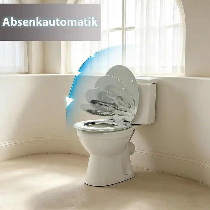 SAINOS WC-Sitz MDF WC-Sitz, Grau, Universal-O-Form, Absenkautomatik, Unten - MDF, Grau, Mit Absenkautomatik - Weißes WC mit Absenkautomatik, das das sanfte Schließen des Deckels demonstriert.