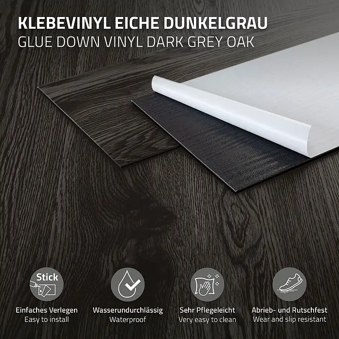 ML-Design Vinylboden 1 x Paket Klebevinylboden ( 16 Stück = 2,23 m² ) - Dunkelgrau, Landhausdiele, 915 x 153 x 2 mm - Dunkelgraue Eiche Klebevinylbodenplanke mit teilweise freigelegter Klebeschicht. Zeigt dunkle Holzmaserung.