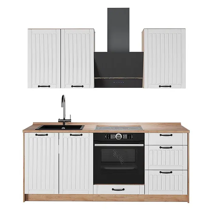 Vicco Singleküche - Breite: 190 cm, Weiß Landhaus, Mit AP Eiche - Weiße Küchenzeile mit geriffelten Türen, Holzoptik-Arbeitsplatte, schwarzer Spüle, Kochfeld, Ofen und Dunstabzugshaube.