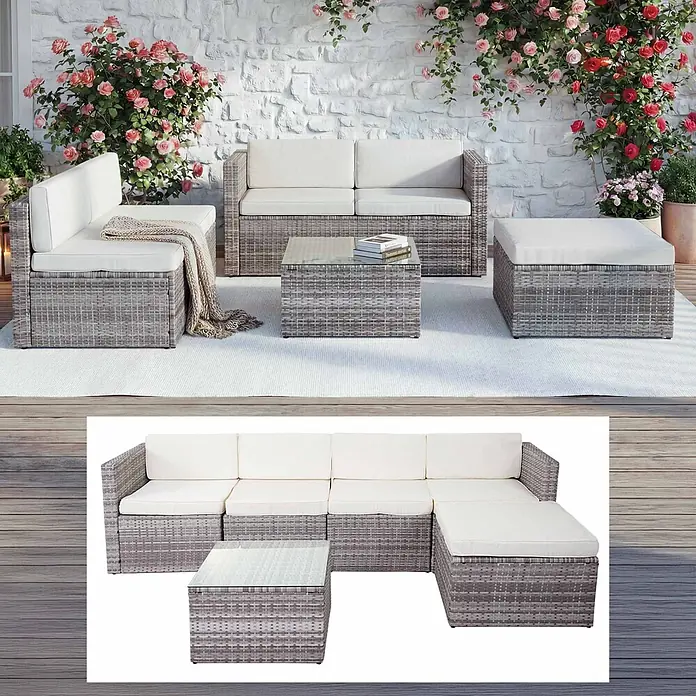 Mendler Poly-Rattan-Garnitur HWC-D24 - grau, Polster creme -  - Modulares Gartensofa-Set aus grauem Rattan mit weißen Kissen, Couchtisch und Ottoman auf einer Terrasse arrangiert.