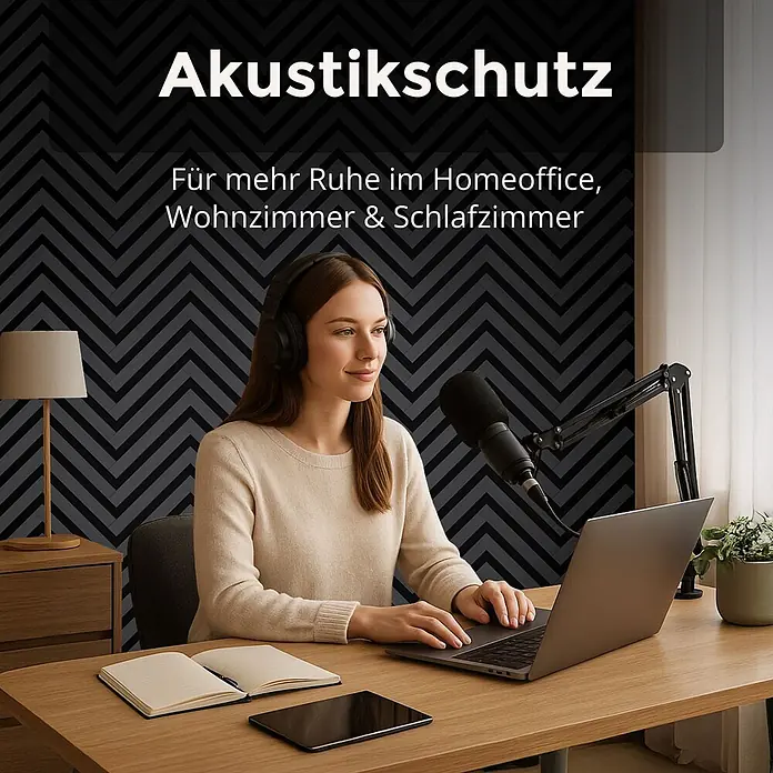 Dalsys Akustikpaneel 4x 120 x 54cm V-Muster Eiche Schwarz - Schwarz - Eine Frau arbeitet am Laptop in einem Homeoffice mit dunklen Akustikwandpaneelen im Fischgrätmuster für mehr Ruhe.