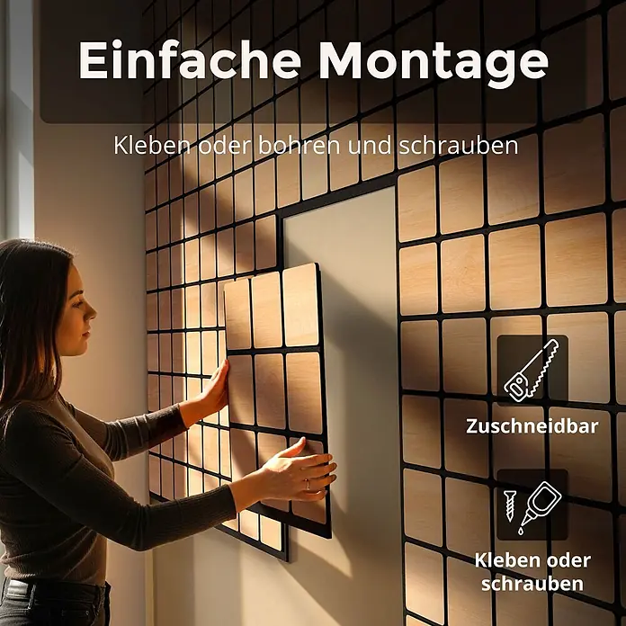 Dalsys Akustikpaneel 4x 60 x 60cm Quadrat Eiche Schwarz - Schwarz - Eine Frau installiert hellbraune Holzoptik-Wandpaneele mit dunklem Gitter. Sie sind einfach anzubringen, zuschneidbar und können geklebt oder verschraubt werden.