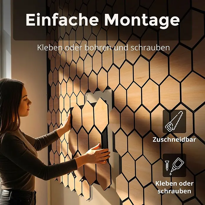 Dalsys Akustikpaneel 4x 76 x 62cm Hexagon Eiche Schwarz - Schwarz - Frau installiert sechseckige Akustikpaneele aus Holz und Schwarz. Einfach zuschneidbar, kleb- oder schraubbar.