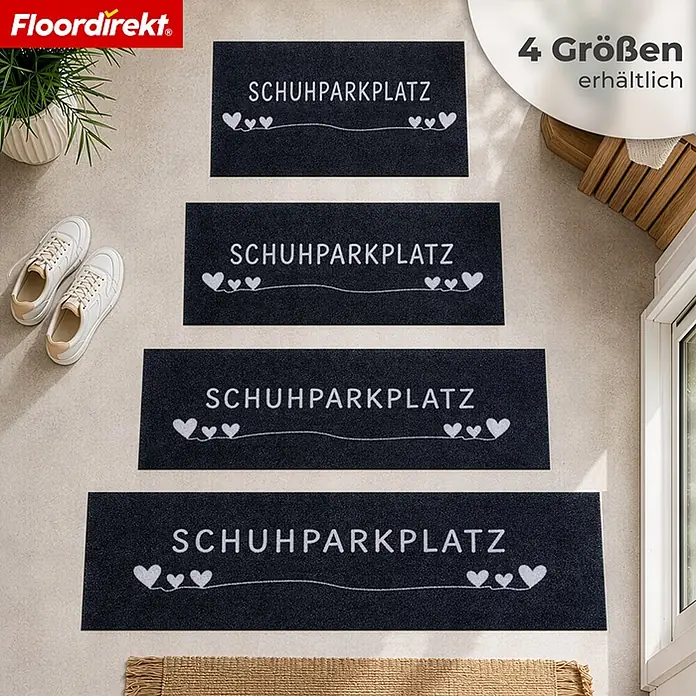 Floordirekt Fußmatte - 30 x 75 cm, Anthrazit, Material Nutzschicht: Polyamid - Vier schwarze Fußmatten mit weißem 'SCHUHPARKPLATZ'-Text und Herz-Details, in 4 Größen im Eingangsbereich gezeigt.