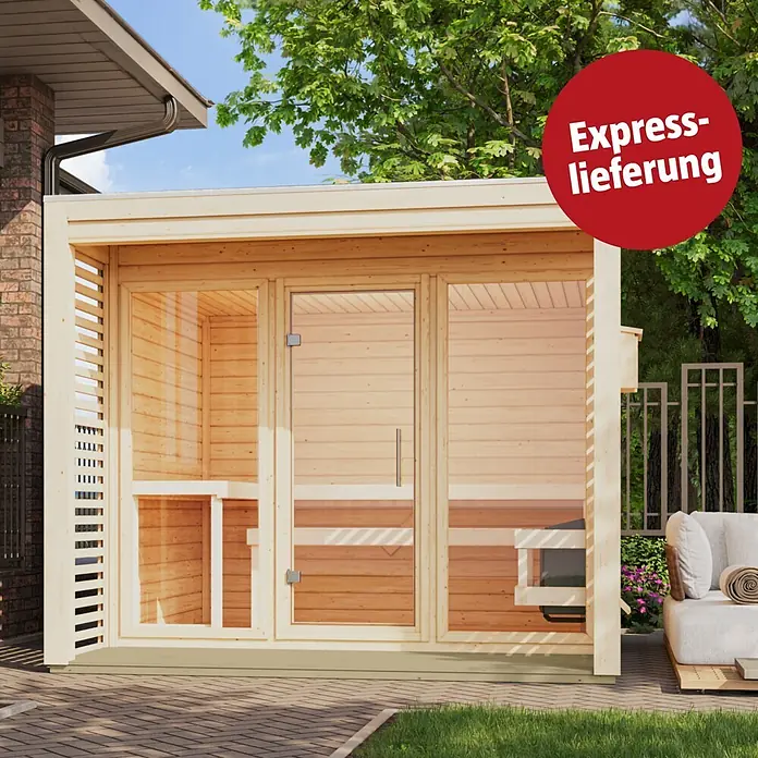 Karibu Saunahaus Heimdall - 9 KW Ofen mit interner Steuerung, Natur, L x B x H: 276 x 276 x 231,5 cm - Außen-Sauna aus hellem Holz mit Glaselementen und integrierter Pergola, auf einer Terrasse platziert.