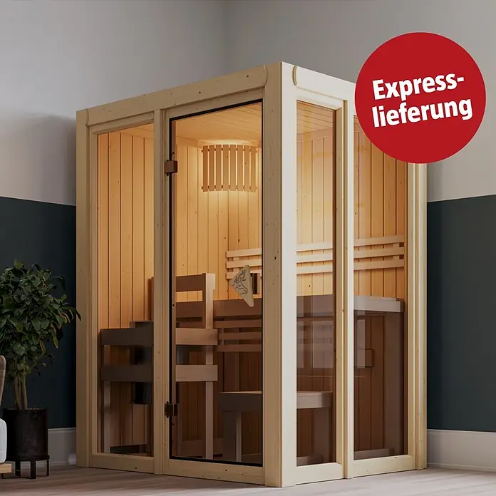 Karibu Elementsauna Balder - L x B x H: 122 x 155 x 198 cm, Plug & Play 3,6 KW Ofen mit interner Steuerung - Helle Holz-Saunakabine mit Glastüren in einem modernen Raum.