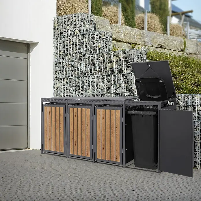 ML-Design Mülltonnenbox 4er 240L 260x80x120 cm Anthrazit-Holzoptik -  - Dreifache Mülltonnenbox mit grauem Rahmen und Holzverkleidung, eine offene Tür zeigt eine schwarze Mülltonne. Steht draußen vor einem Haus.
