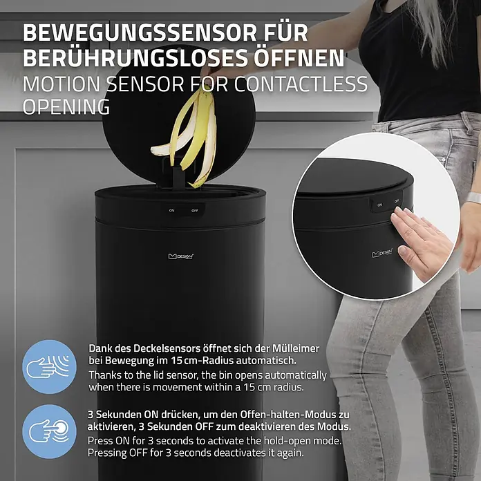 Mülleimer mit Sensor 40L rund aus Stahl Schwarz matt Automatisch -  - Schwarzer Mülleimer mit Bewegungssensor in häuslicher Umgebung, zeigt kontaktloses Öffnen durch Handbewegung am Sensor.