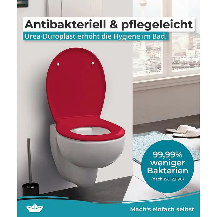 Calmwaters WC-Sitz Original - Duroplast, Rot, Mit Absenkautomatik - Roter antibakterieller Urea-Duroplast Toilettensitz auf einer weißen Toilette im Bad.