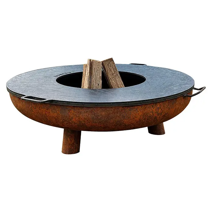 Nora Flames Brasero Calsotera con patas + plancha - Diámetro: 80 cm, Acero Corten - Brasero de metal oxidado con superficie de cocción/parrilla gris oscuro y troncos en el centro. Patas robustas y asas laterales para cocinar al aire libre.