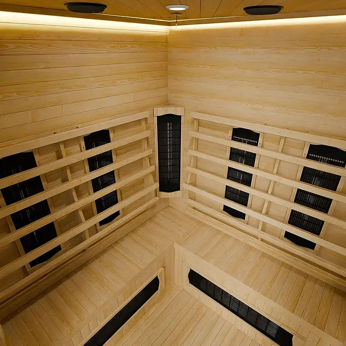 Artsauna Elementsauna - L x B x H: 150 x 150 x 190 cm - Innenansicht einer Infrarotsauna aus hellem Holz mit schwarzen Heizelementen und integrierter Beleuchtung.