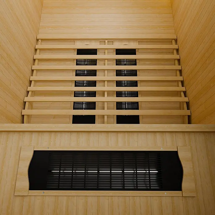 Artsauna Elementsauna - L x B x H: 105 x 120 x 190 cm - Innenansicht einer Saunakabine aus hellem Holz mit Bänken und schwarz vergitterten Infrarotstrahlern an der Rückwand.