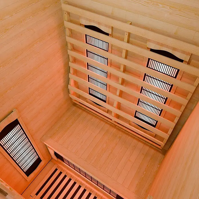 Infrarotkabine Nyborg S90V Vollspektrumstrahler & LED Beleuchtung -  - Infrarotsauna-Innenraum aus hellem Holz mit mehreren leuchtenden Heizelementen.