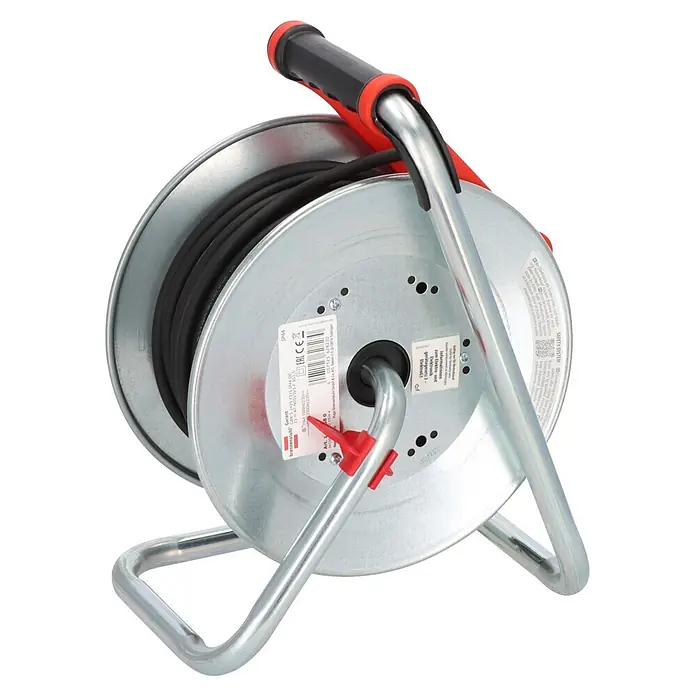 Brennenstuhl Kabeltrommel - Stahlblech, 25 m, N05V3V3-F, IP44 - Silberfarbene Metallkabeltrommel mit schwarzem Kabel, rotem und schwarzem Griff, und stabilem Rahmen.