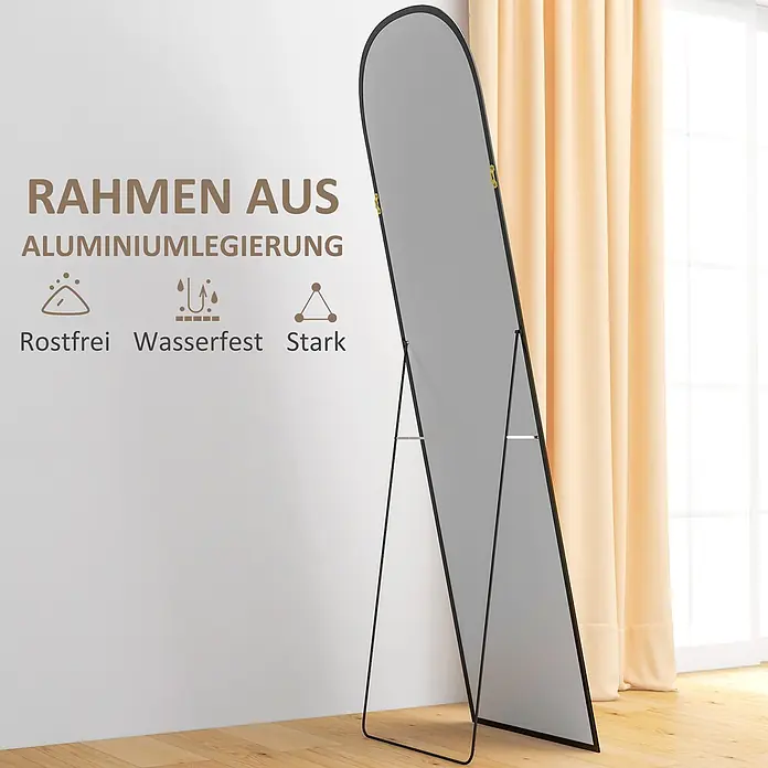 Homcom Standspiegel - Schwarz, Glas - Schwarzer Standspiegel mit Aluminiumlegierungsrahmen und integriertem Ständer, in einem Raum gezeigt.