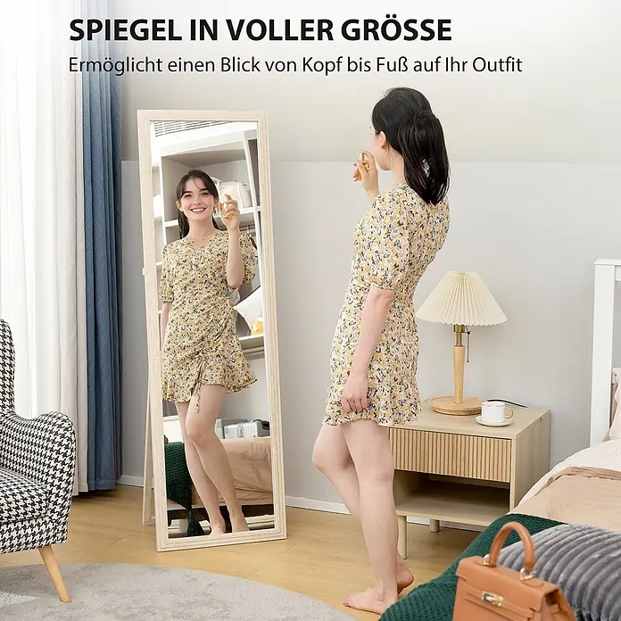 HOMCOM-Ganzkörperspiegel-50L x 4B x 160H cm-Weiß -  - Standspiegel mit hellem Holzrahmen, in dem eine Frau ihr Outfit im Schlafzimmer betrachtet.