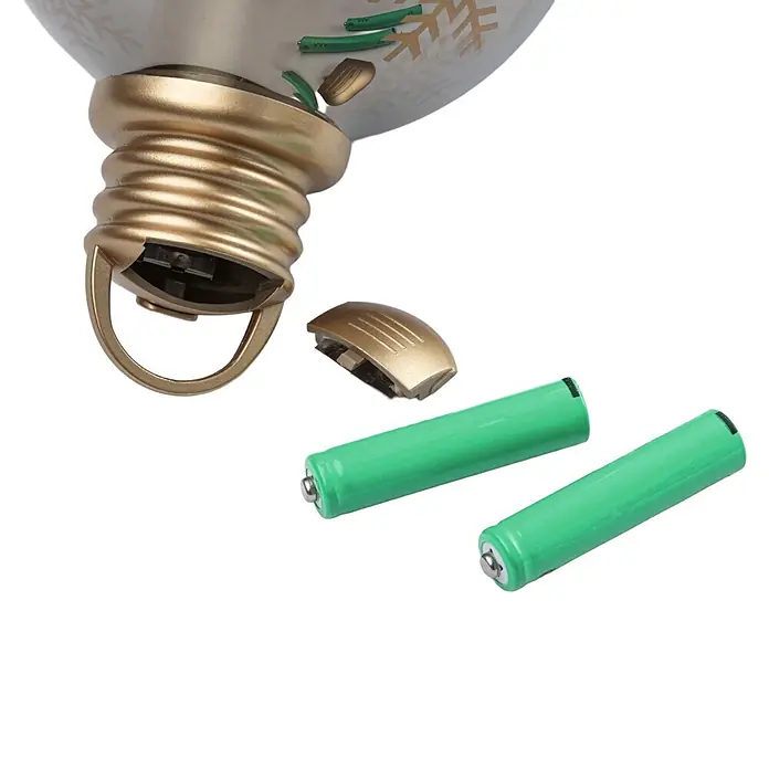 Paulmann LED-Weihnachtsdekoleuchte Christmas Globe - Braunglas, Batteriebetrieben, LED - Goldener Glühbirnen-Sockel mit offenem Batteriefach und zwei grünen Batterien.