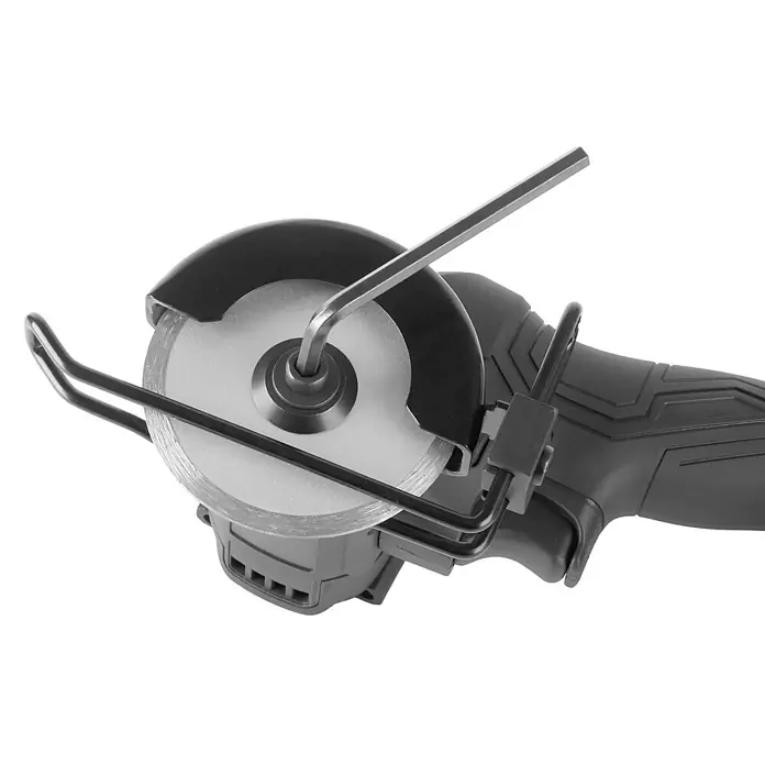 STAHLWERK Akku-Winkelschleifer Mini-Akku-Winkelschleifer MAW-20 ST – 2 Ah Akku - 20 V, 1 Akku, 20 U/min - Dunkelgraue Minikreissäge mit silbernem Sägeblatt, zeigt einen Inbusschlüssel zur Befestigung des Blattes.