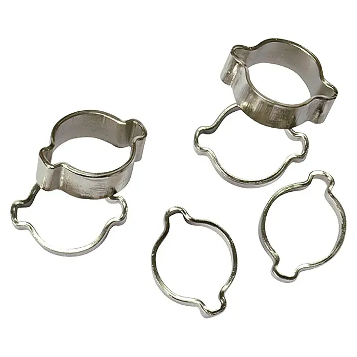 Craftomat Klemmring-Set - Geeignet für: Druckluftschlauch 8 x 13 mm, 6 Stk. - Das Bild zeigt eine Nahaufnahme von fünf silbernen Ohrschellen, die auf einer weißen Oberfläche angeordnet sind. Sie dienen zur Befestigung von Schläuchen.