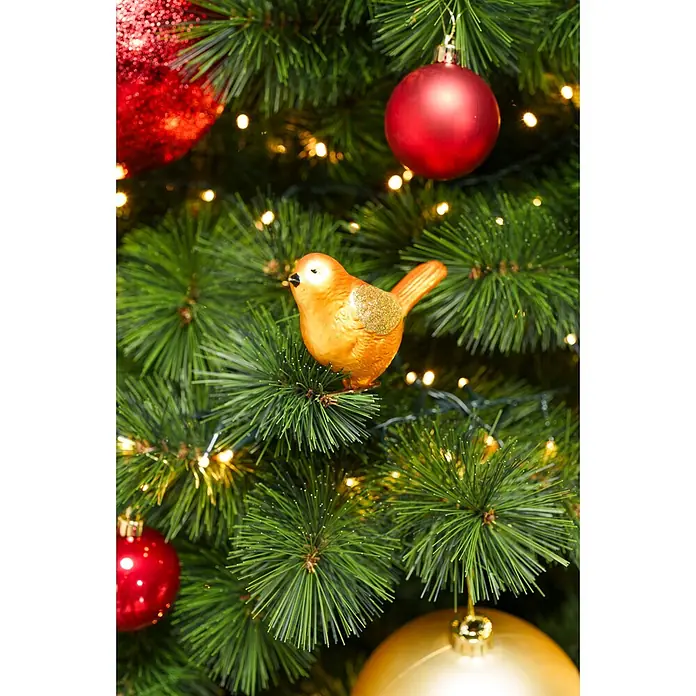 Dekofigur Vögel - Kunststoff - Ein goldener Vogel-Ornament mit Glitzer an einem grünen Weihnachtsbaum, umgeben von roten und goldenen Kugeln und warmen Lichterketten.