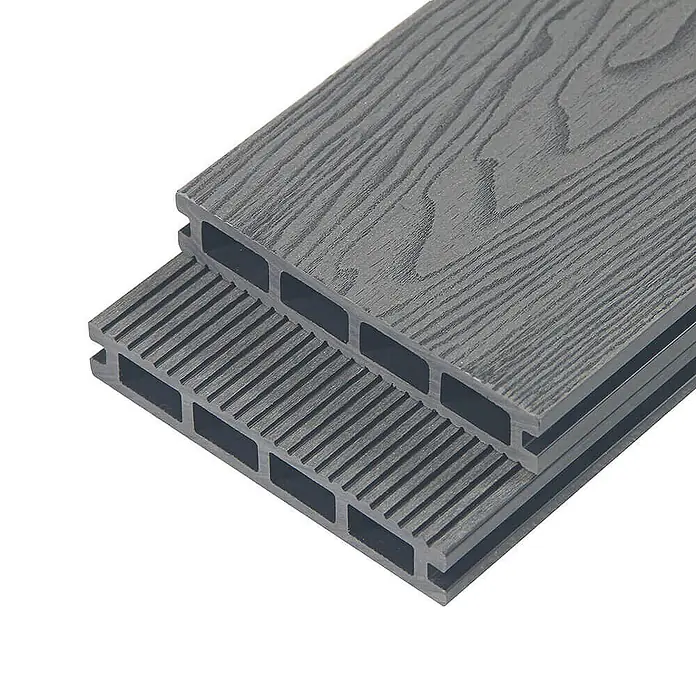 Home Deluxe WPC Terrassendielen SAMANA PREMIUM Anthrazit 2m² -  - Zwei gestapelte dunkelgraue WPC-Terrassendielen, eine Seite Holzmaserung, die andere geriffelt, mit Hohlkammern.