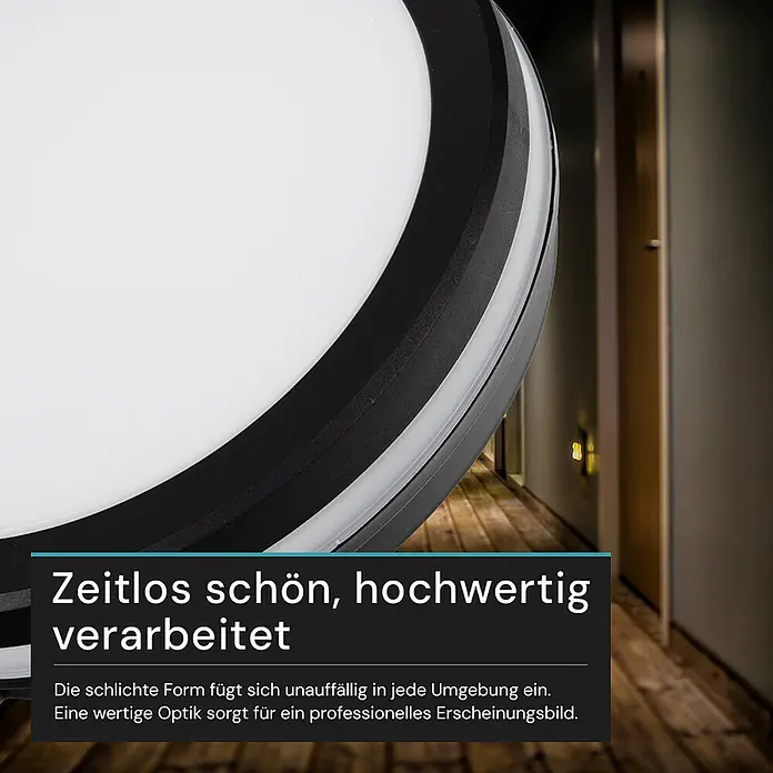 Luxula LED-Deckenleuchte rund - 30 W, Schwarz, Mehrfarbig - Runde LED-Deckenleuchte mit weißem Diffusor und schwarzem Rahmen, in einem modernen Flur montiert.