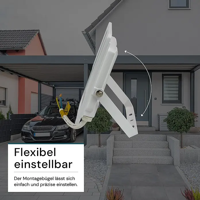 Luxula LED-Strahler - 30 W, 3.000 lm, IP65 - Weißer LED-Fluter mit verstellbarem Montagebügel, in einer Hausumgebung geneigt dargestellt. Der Bügel ermöglicht eine einfache und präzise Einstellung.
