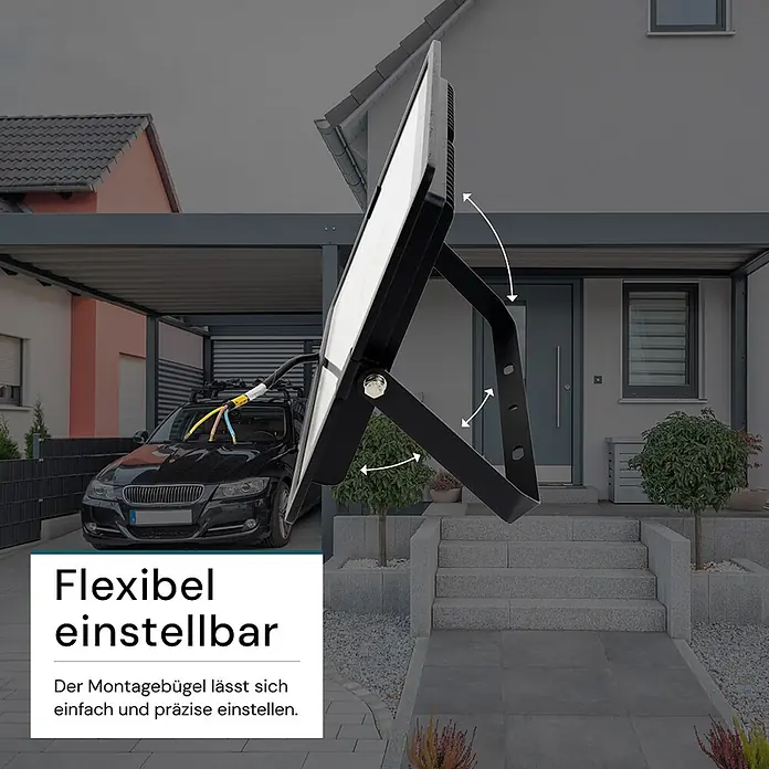 Luxula LED-Strahler - 200 W, 20.000 lm, 4.000 K, IP65 - Schwarzer LED-Fluter mit verstellbarem Montagebügel, an einem Hauseingang platziert.