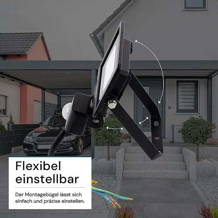 Luxula LED-Strahler Fluter Bewegungsmelder 10W 3000K Warmweiß 1000lm -  - Schwarzer Flutlichtstrahler mit Bewegungsmelder und verstellbarem Montagebügel, im Außenbereich eines Hauses.
