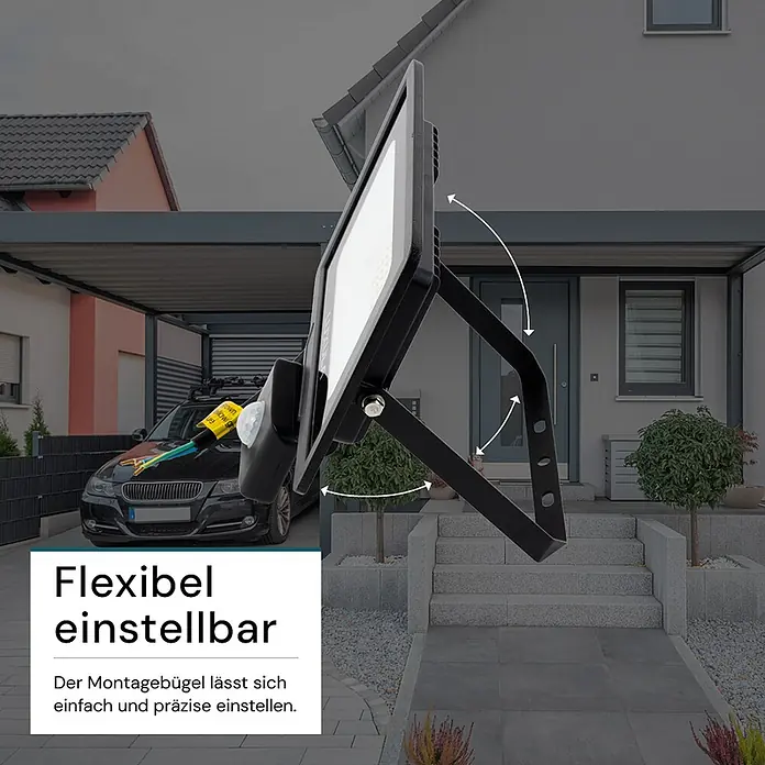 Luxula LED-Strahler Fluter Bewegungsmelder 30W 3000K Warmweiß 3000lm -  - Schwarzer LED-Fluter mit Bewegungsmelder und einfach einstellbarem Montagebügel, im Außeneinsatz bei einem Haus gezeigt.