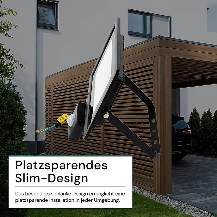 Luxula LED-Strahler Fluter Bewegungsmelder 30W 4000K Neutralweiß 3000lm -  - Schlanker, schwarzer LED-Fluter mit Bewegungssensor im Außenbereich, der sein platzsparendes Design für einfache Installation hervorhebt.