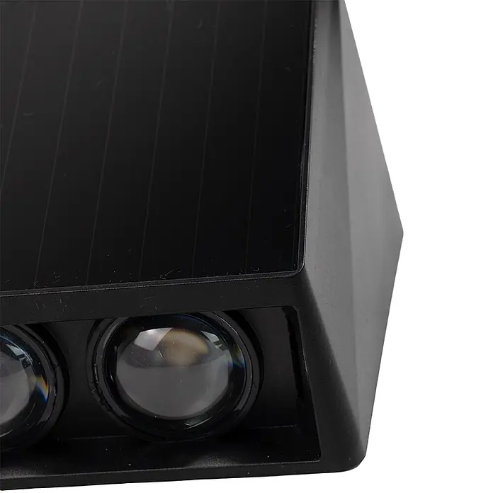 Luxula Solar-Außenwandleuchte Wandleuchte 2-flammig Up/Down CCT Warm- -  - Nahaufnahme einer schwarzen Solar-Außenleuchte mit Solarpanel oben und zwei Linsen vorne.