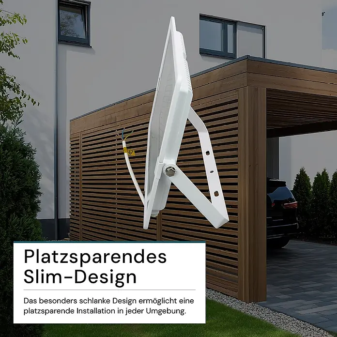 Luxula LED-Strahler - 200 W, 20.000 lm, IP65 - Weißer schlanker LED-Fluter im Außenbereich, neben Carport und Gebäude. Sein Design ermöglicht platzsparende Installation.