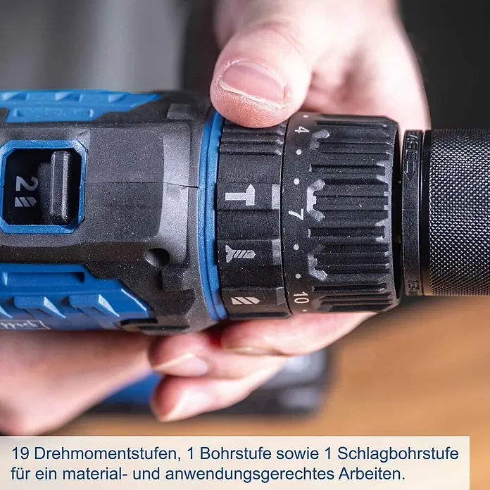 Scheppach IXES 20V Akku-Schlagbohrschrauber C-CD45-X - 20 V, Ohne Akku, 45 Nm - Blauer und schwarzer Akku-Bohrschrauber. Eine Hand verstellt das Drehmoment- und Modus-Einstellrad mit 2-Gang-Wahl und verschiedenen Stufen.