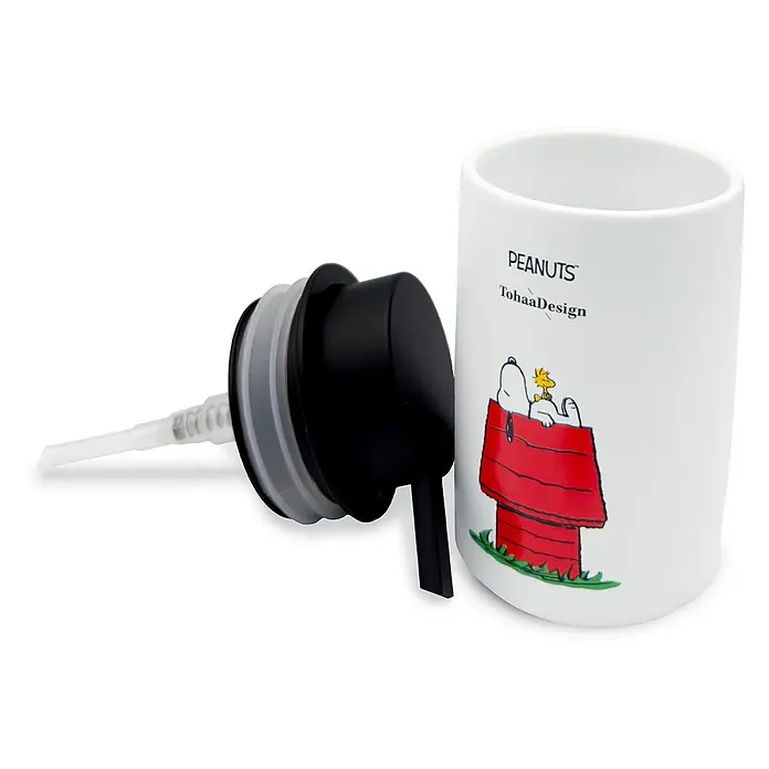 Tohaa Design Seifenspender Snoopy House - Peanuts -  - Weißer Keramik-Seifenspender mit Snoopy-Motiv und abgenommenem schwarzem Pumpmechanismus.