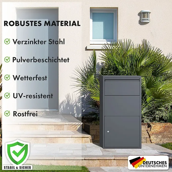 Floordirekt Paketbox Clement mit Klappsystem und Schloss - Anthrazit, Stahl, Paketfach - Dunkelgrauer, robuster Paketbriefkasten aus verzinktem, pulverbeschichtetem Stahl, wetterfest und rostfrei, steht im Freien vor einem Hauseingang.