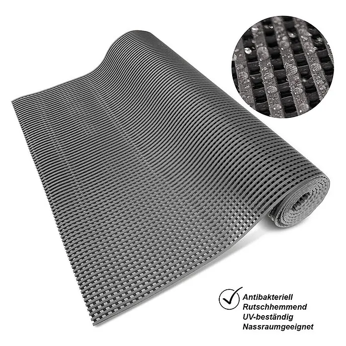 Floordirekt Antirutschmatte Adria - Arbeitsplatzmatte für Nasszonen - Grau - 120 x 100 cm -  - Graue strukturierte Antirutschmatte, teilweise aufgerollt, für Nassräume geeignet.