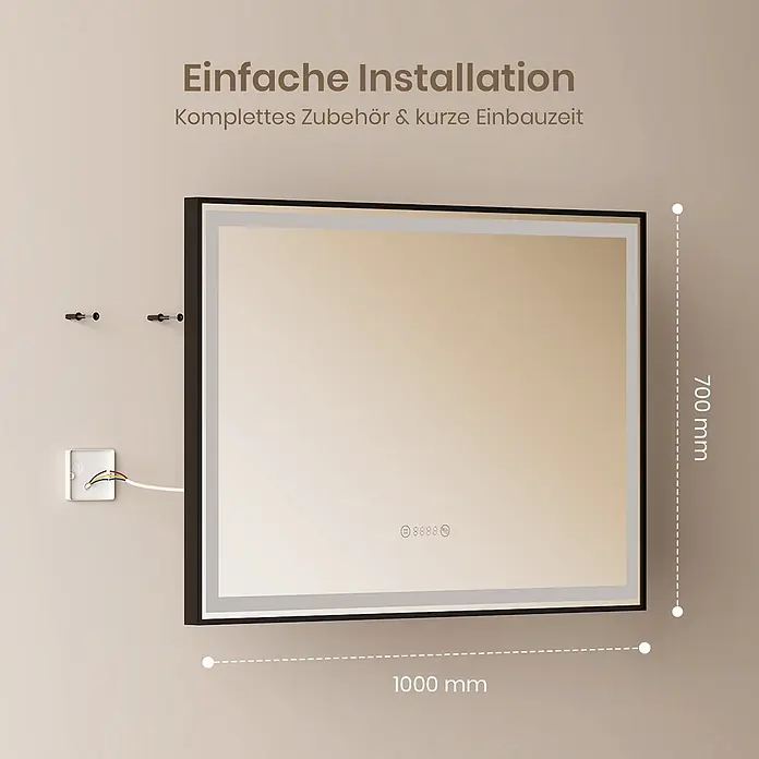 Emke Lichtspiegel Frolite LM23 -  - Rechteckiger beleuchteter Spiegel mit schwarzem Rahmen, während der Installation gezeigt. Maße: 1000mm x 700mm für einfache Montage.