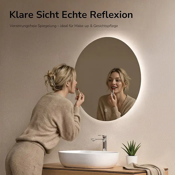Emke Lichtspiegel Glowrim OLM03 - 60 x 60 cm - Frau trägt Make-up vor einem runden, hinterleuchteten, verzerrungsfreien Spiegel über einem Waschbecken, ideal für die Gesichtspflege.