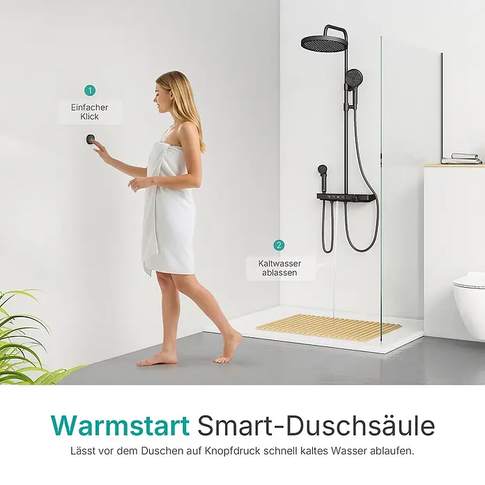 Duschsysteme Slimtrim F23 -  - Schwarze Smart-Duschsäule mit Warmstartfunktion, die kaltes Wasser ablässt. Eine Frau aktiviert sie per Knopfdruck.